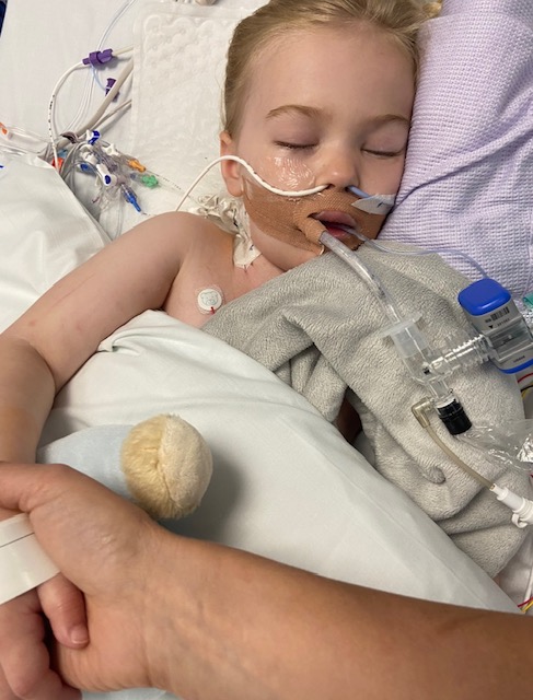 Young child in hospital bed.